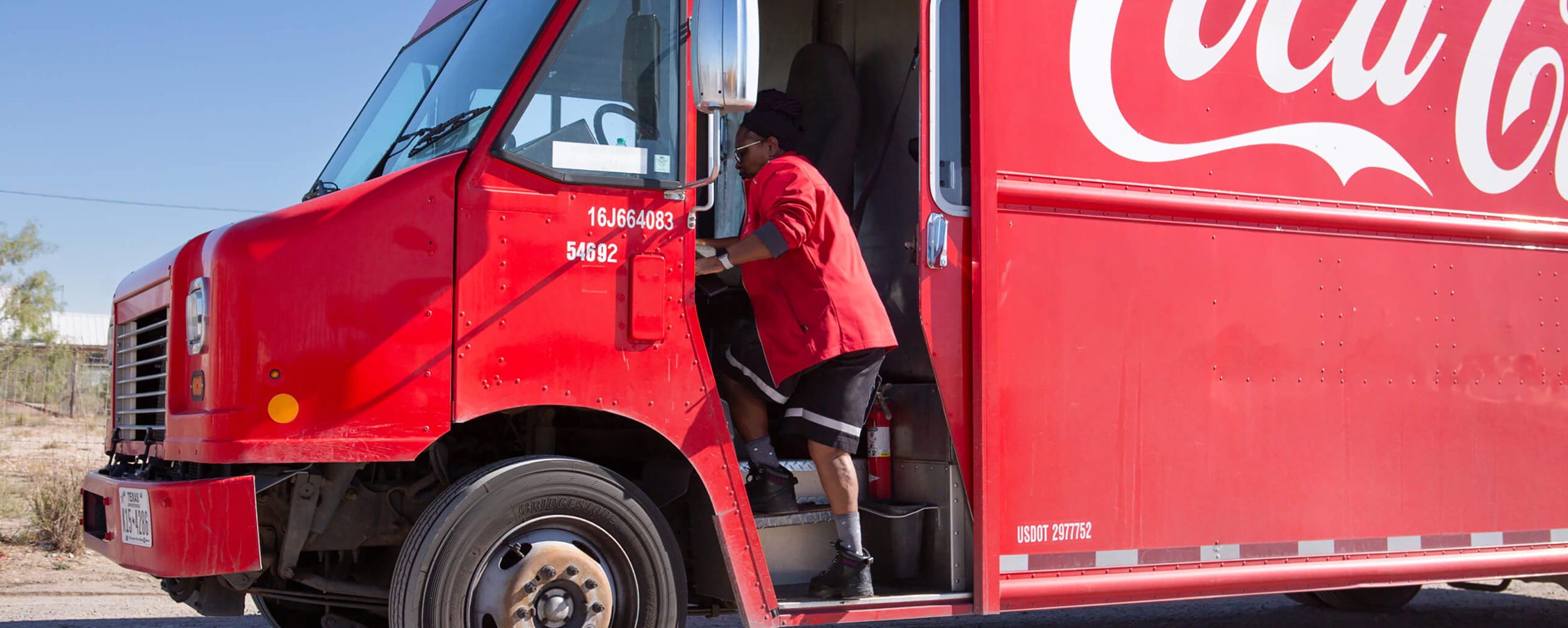 Woman getting in Coca-Cola truck